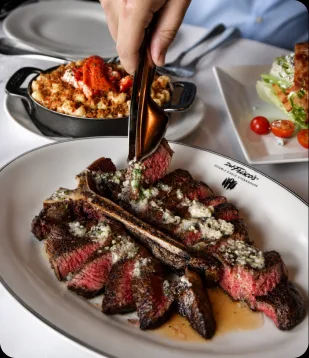 Prime steaks and red wine at the AI Edge Table dinner