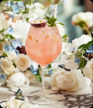 A pink spritz among the flowers at Daphne's