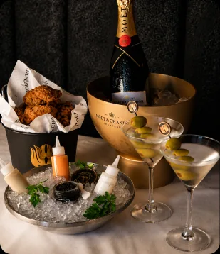 Champagne on ice beside the bread basket at Del Frisco's