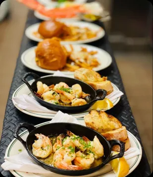 Cast-iron skillets of seafood at Manny's Steakhouse
