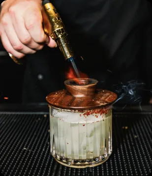 A smoked cocktail being torched at the House of Blues bar