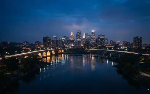 Minneapolis skyline over the Mississippi at dusk