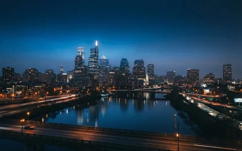Philadelphia skyline over the Schuylkill River at dusk
